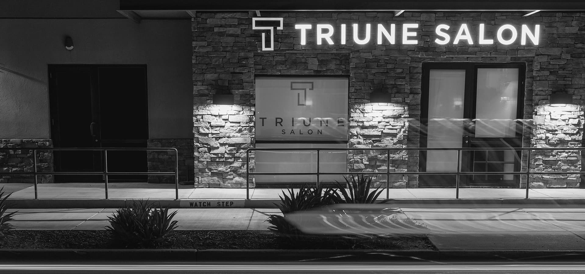 Black and white photograph of the Triune Salon studio
